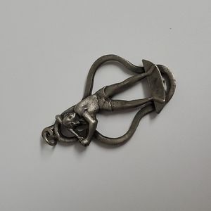 Large vintage heavy metal (seems to be pewter) girl softball player pendant